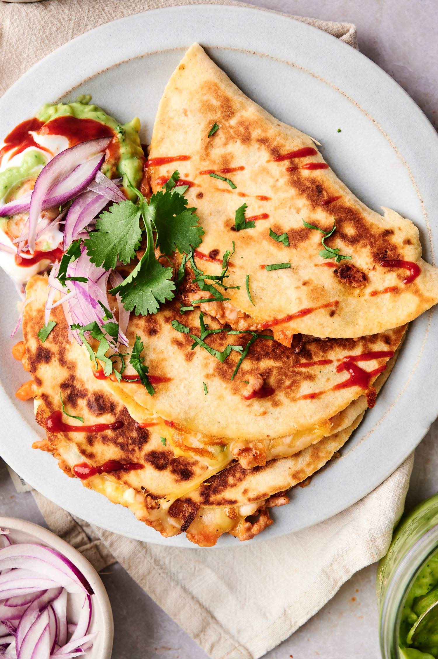 Easy buffalo chicken quesadilla stacked on top of each other.
