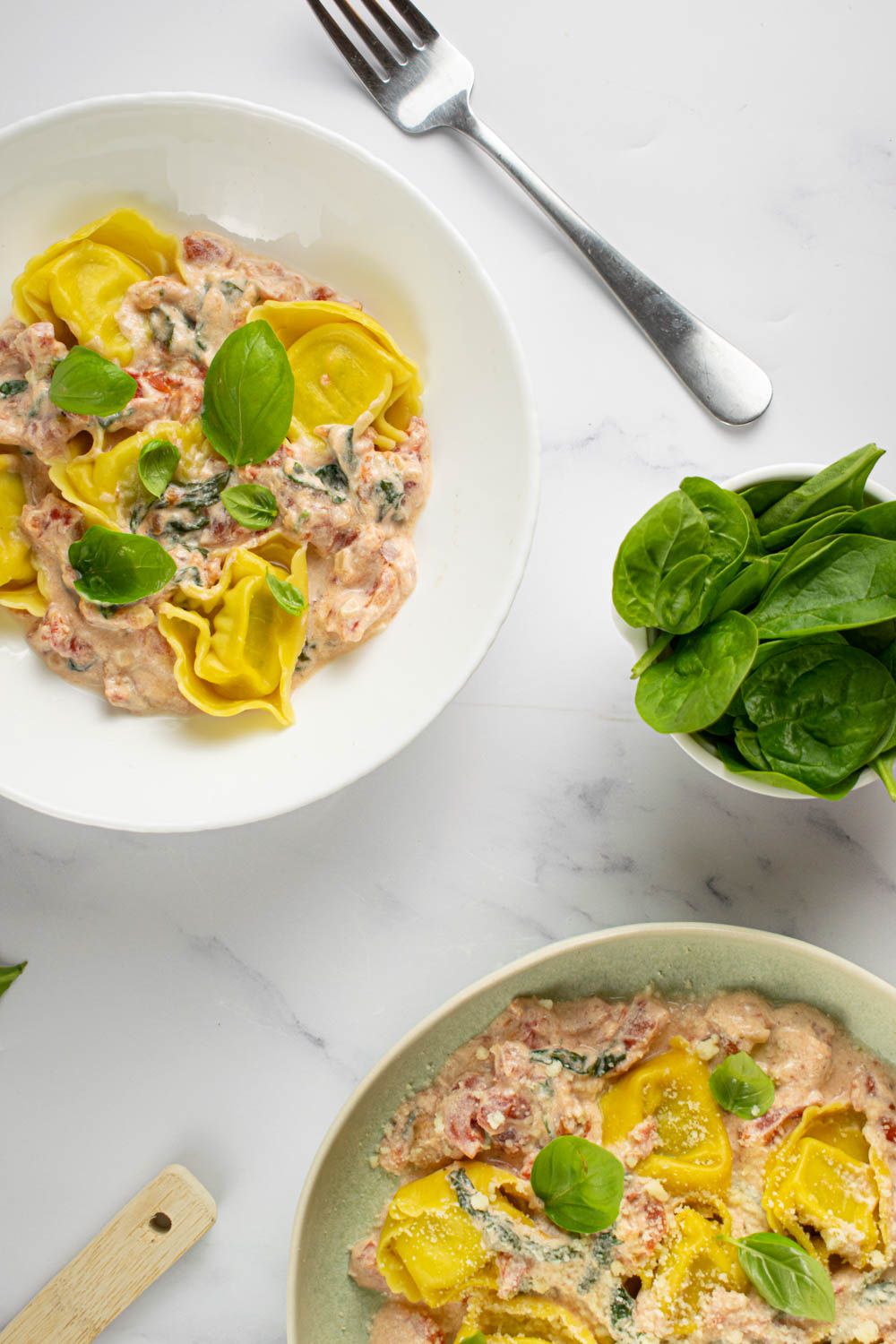 Creamy cheese tortellini with a tomato cream sauce and diced tomatoes with basil.
