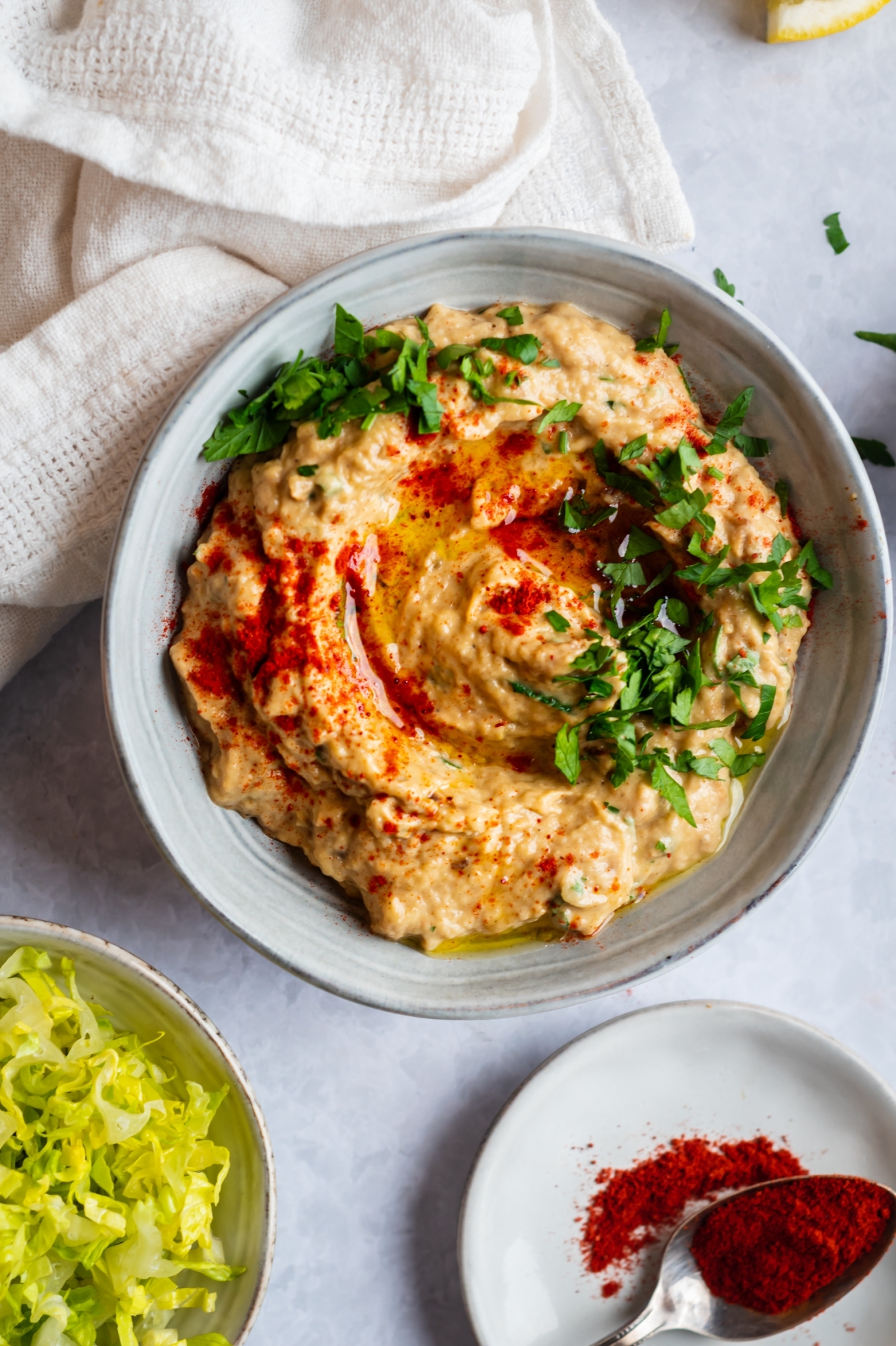 Eggplant dip in a bowl with roasted eggplant, olive oil, garlic, tahini, and spices. 