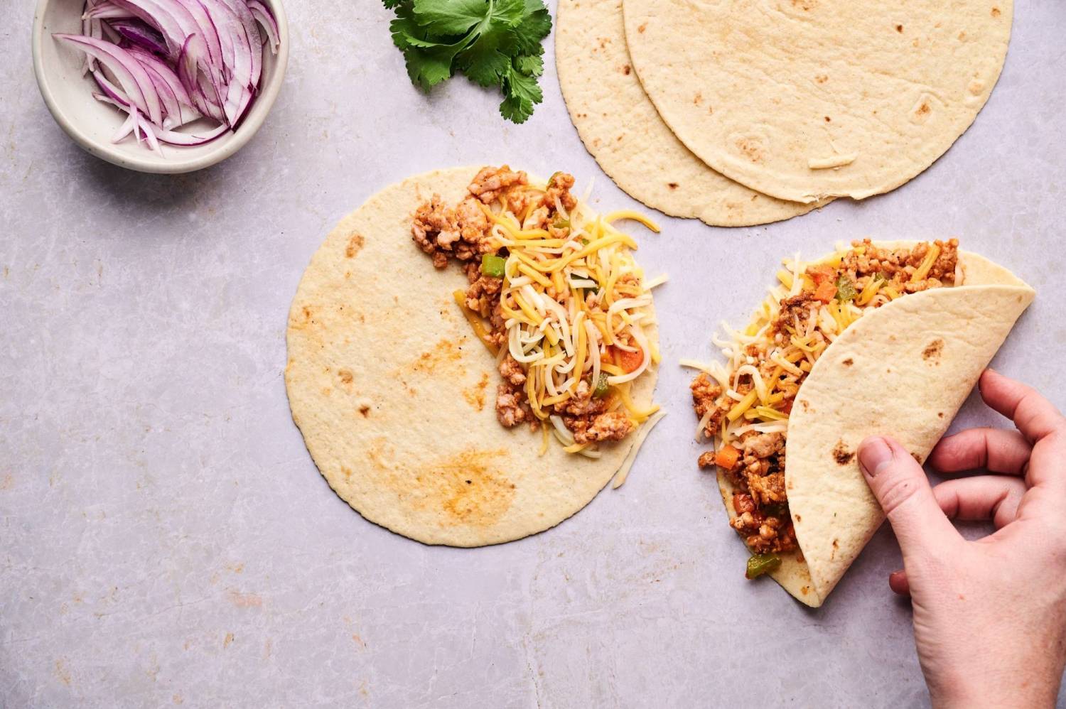 Flour tortillas filled with buffalo chicken and shredded cheese.