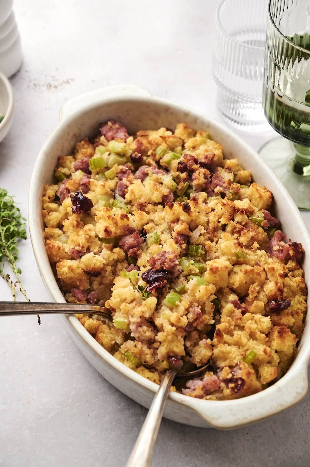 Cornbread stuffing with chicken sausage in baking dish after being baked.