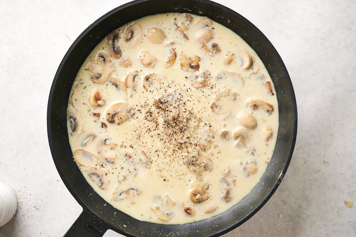 Mushroom sauce being made in a pan.