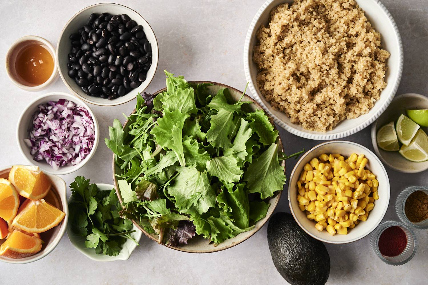 A vibrant mix of quinoa, black beans, corn, fresh greens, and citrus for a refreshing Mexican quinoa salad.
