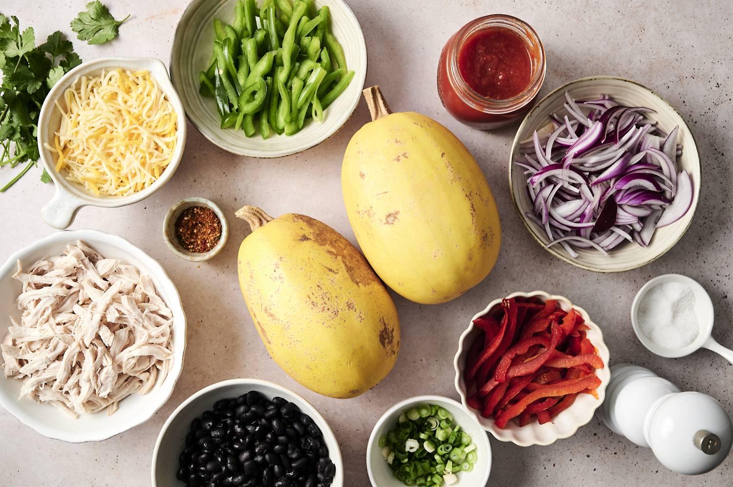 Spaghetti squash with shredded chicken, black beans, cheese, peppers, onions, and enchilada sauce.