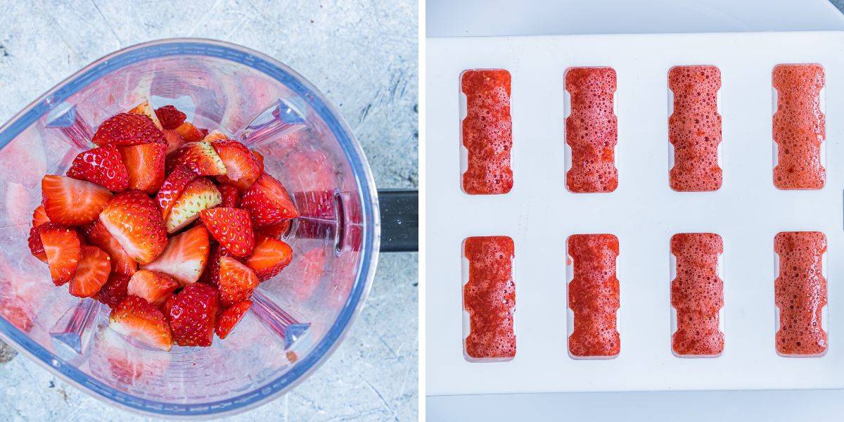 A blender filled with fresh strawberry slices beside a tray of ice cubes filled with blended strawberry puree.