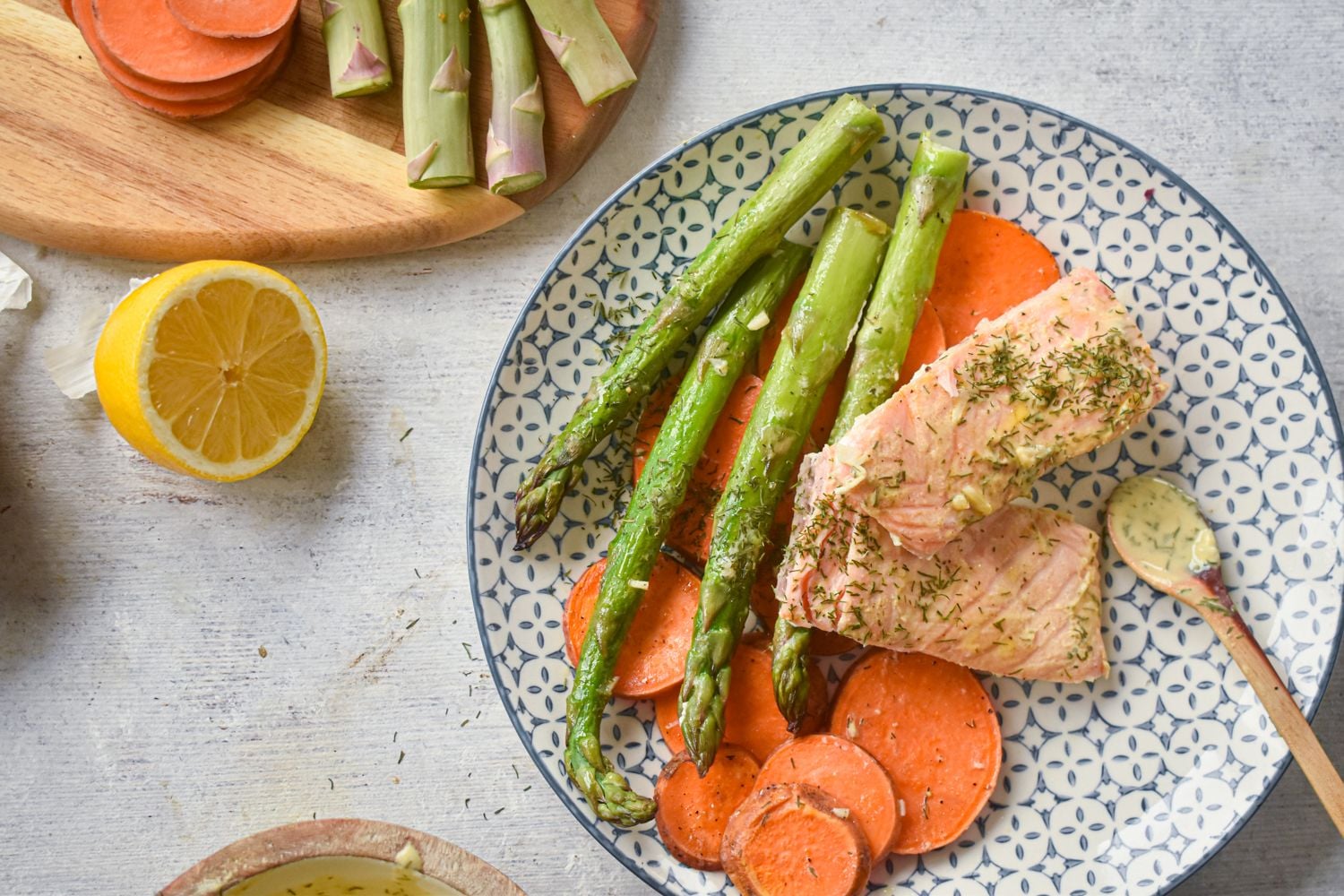 Sheet pan roasted salmon with sweet potatoes, salmon, and asparagus cooked with mustard sauce,