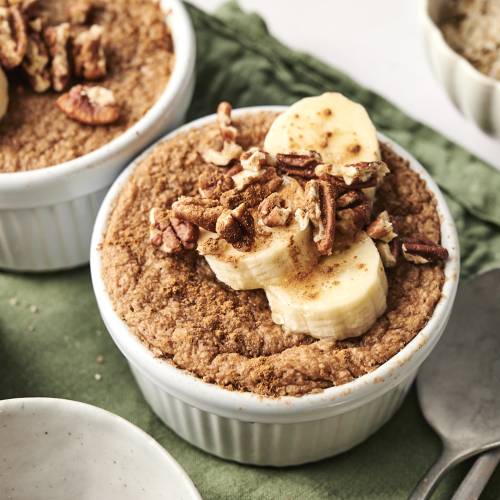 Protein baked oats topped with banana and pecans