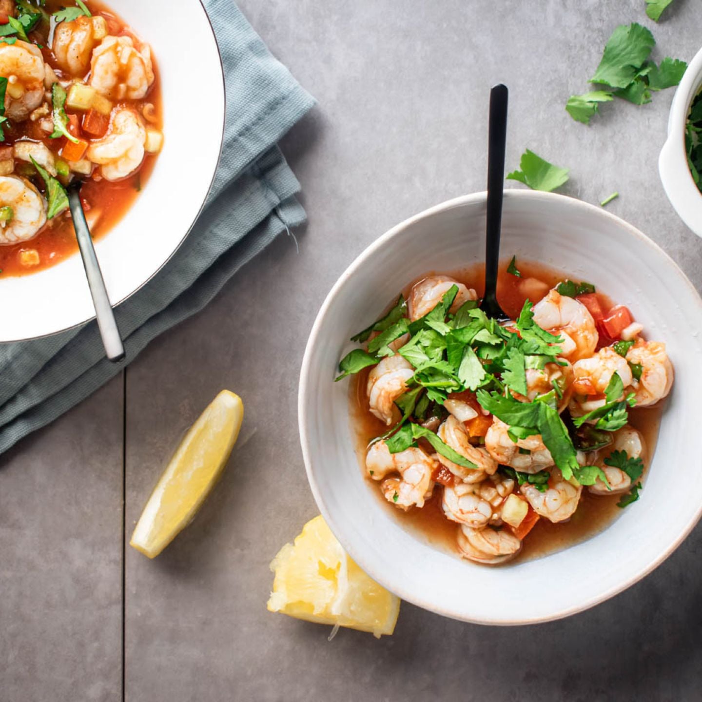 Cóctel de camarones with shrimp marinated in tomato and lime juice served with cilantro.