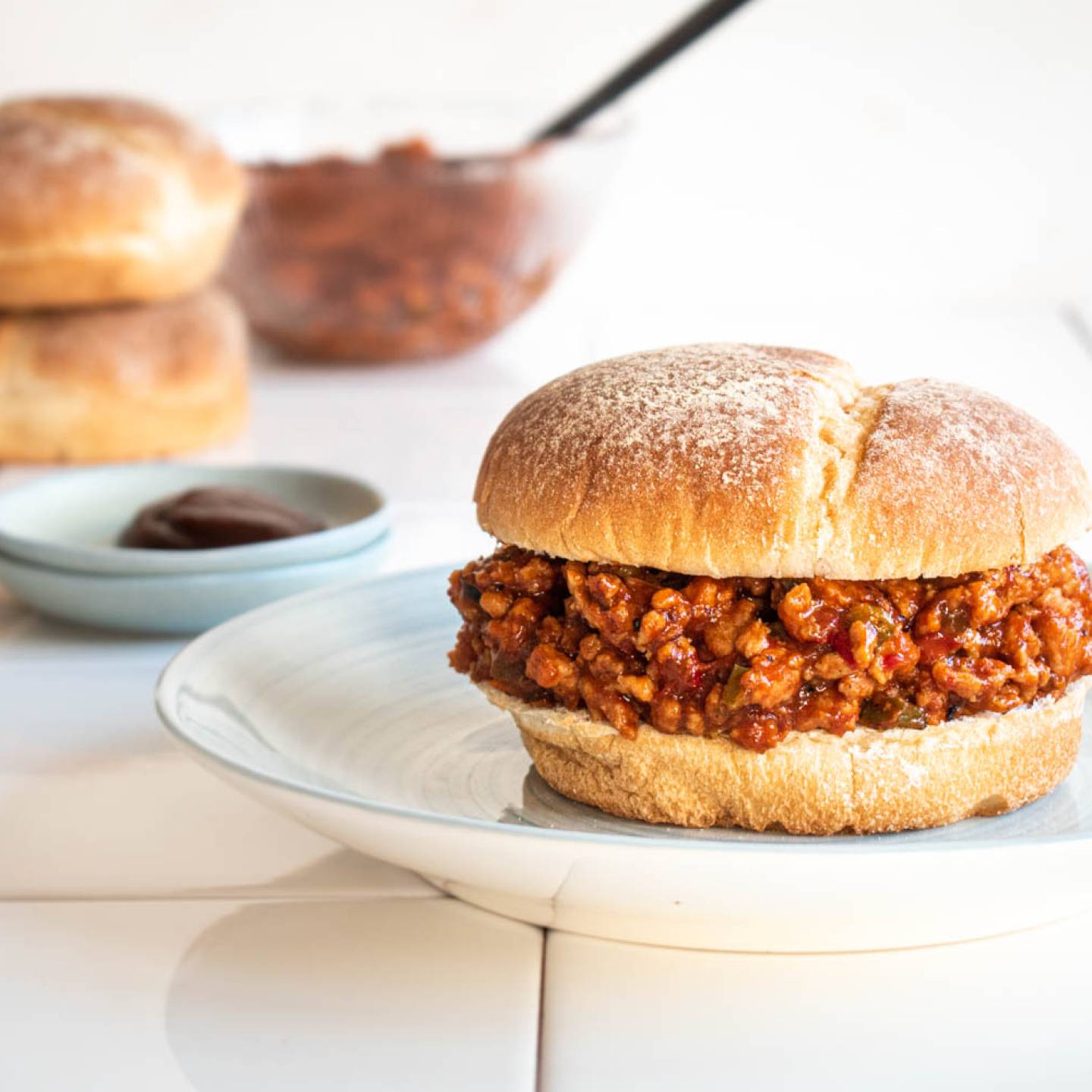 Ground turkey sloppy joes with bell peppers, lean ground turkey, and sloppy joe sauce served on a whole grain bun.