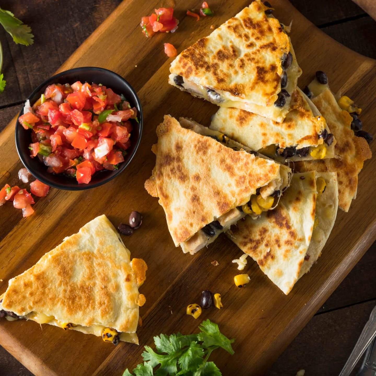 Healthy chicken quesadillas with pico de gallo on the side.