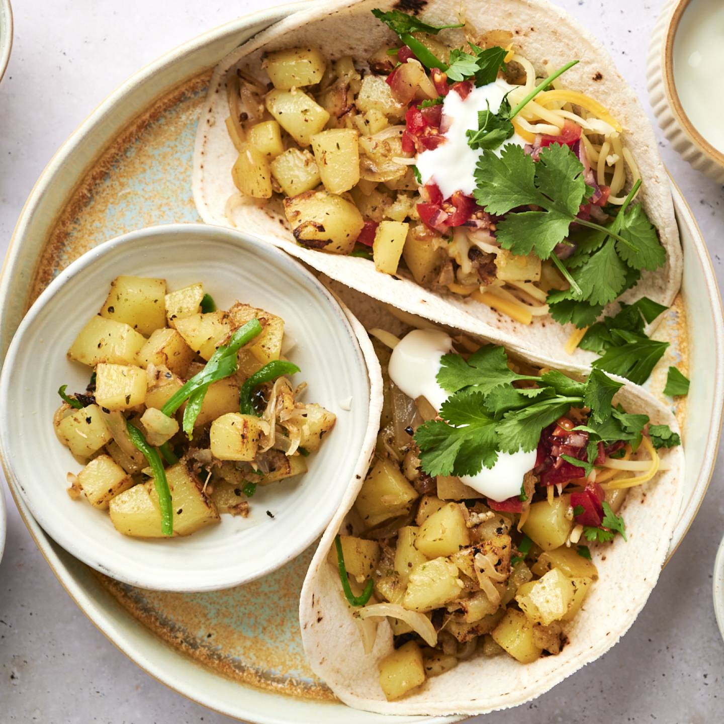 Potato green chile tacos with chopped potatoes, poblano peppers, onions, and salsa served in corn tortillas.