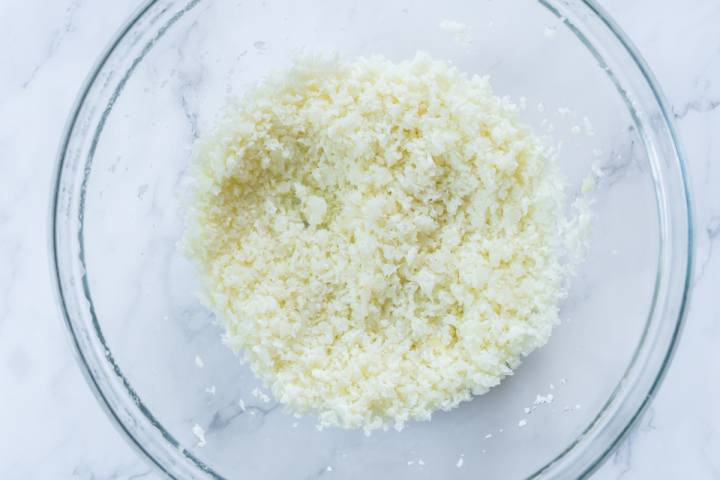 Cauliflower rice in a glass bowl.