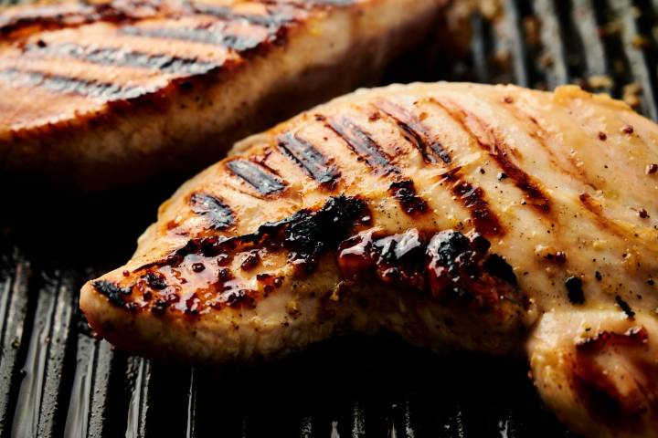 Grilled turkey tenderloins on a grill pan.