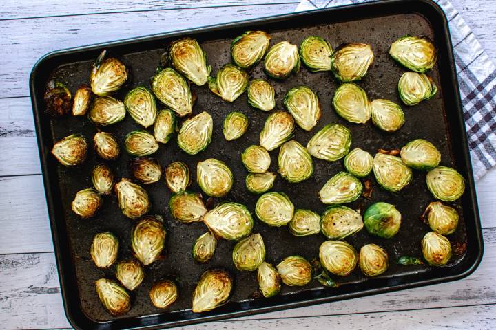 Crispy roasted Brussels sprouts on a baking sheet.