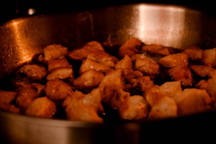 Sesame chicken cooking in the oven in a sesame soy sauce.