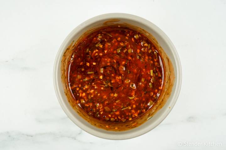 Buffalo sauce mixed with herbs, garlic, and onion for chicken.