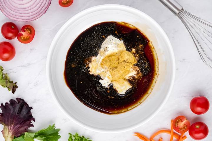 Balsamic vinegar, Greek yogurt, and olive oil in a small bowl.