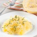 Garlic spaghetti squash on a plate with parsley.
