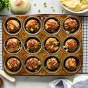 BBQ Meatloaf muffins with ground turkey, red pepper, celery, and a barbecue and mustard sauce in a muffin tin.