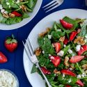 Strawberry spinach salad with poppyseed dressing, feta cheese, and walnuts.